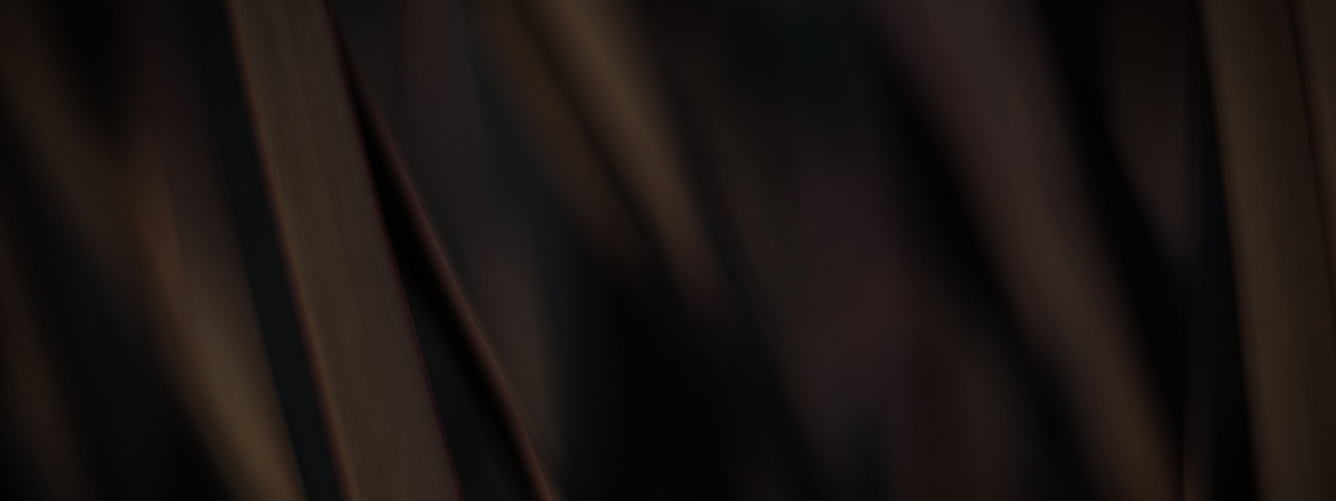 Abstract dark textures with warm tones.