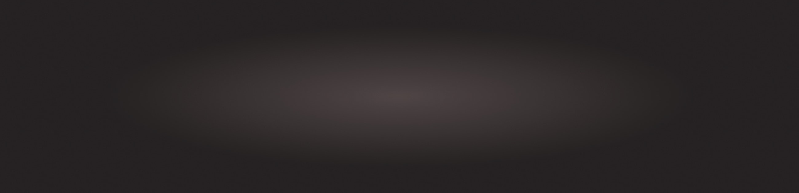 Abstract dark gradient background with soft light.