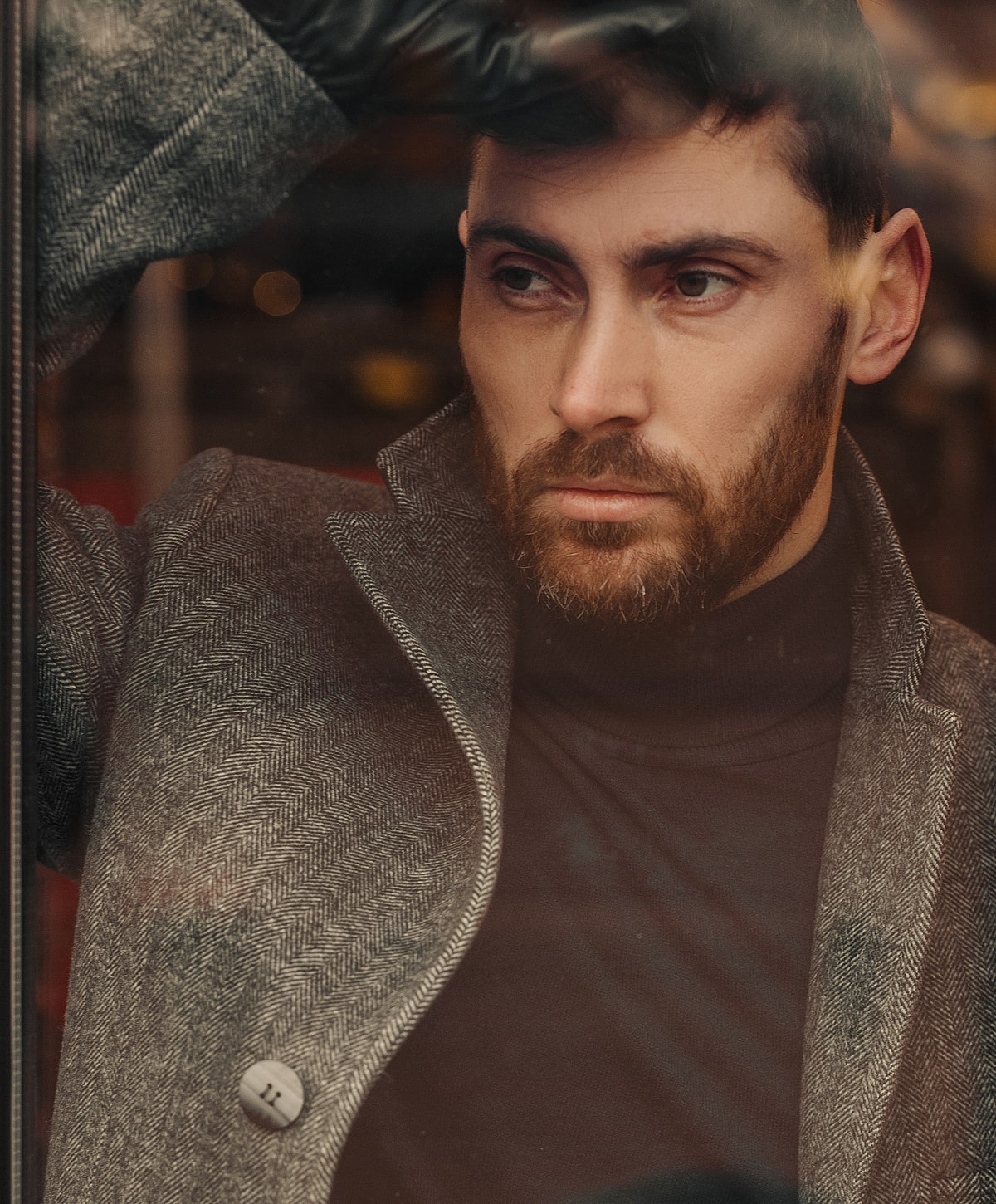 Thoughtful man in stylish winter coat.