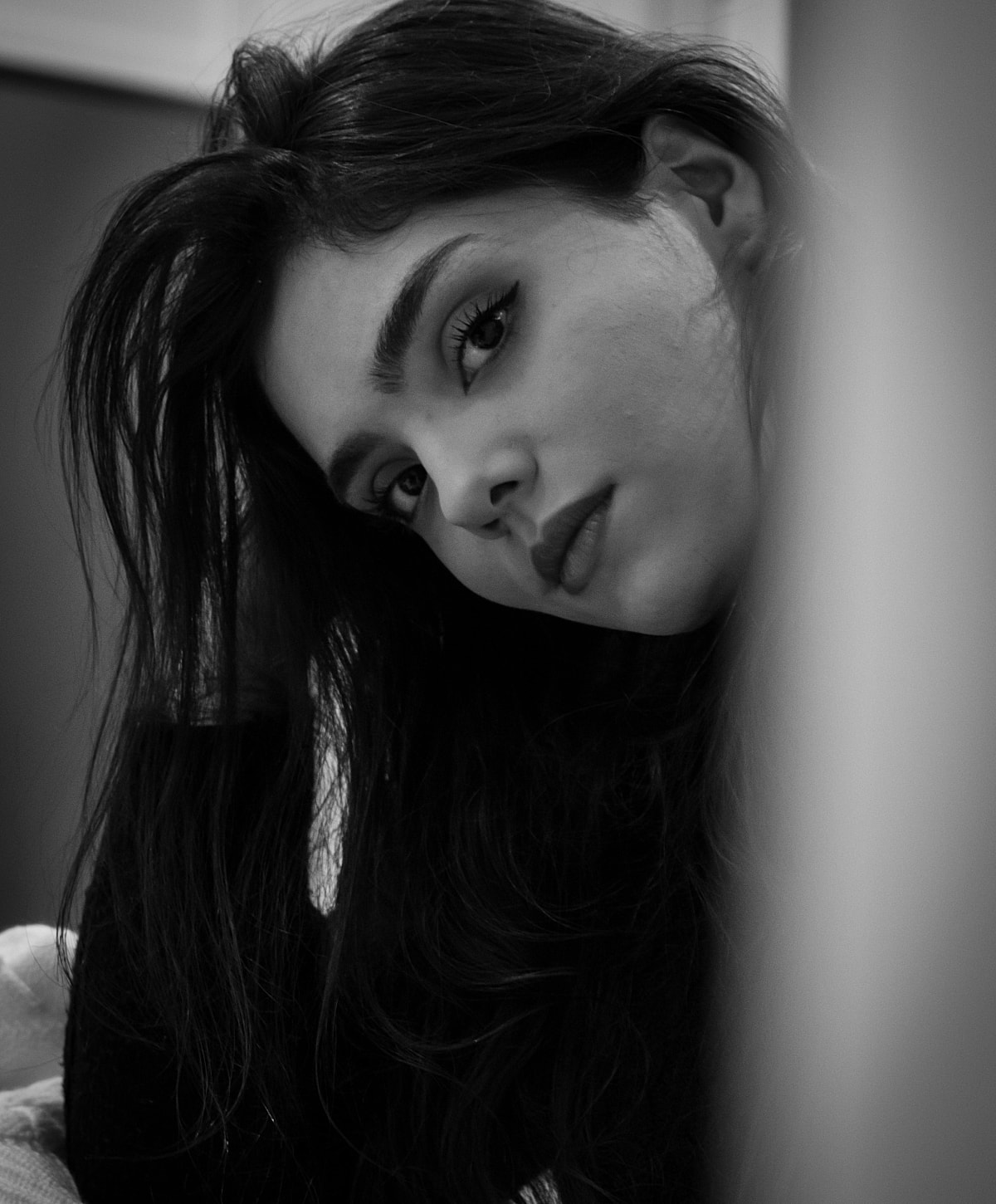NYC reconstructive surgery model posing in black and white.